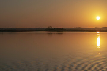 Obraz premium sunset on the river