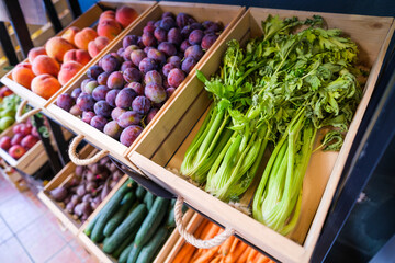 Healthy fruit and vegetables in grocery shop. Close up of baskets with various raw food in supermarket.