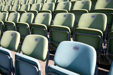 Obraz premium Empty Plastic Chairs at the Stadium