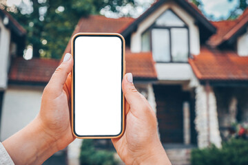 Phone with isolated screen on the background of the cottage