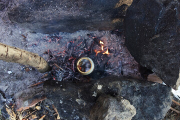 crab boiled in a can in fire outdoor survival technique in danube delta