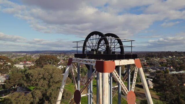 Close-up circling drone shot of Victoria Hill Mining Reserve poppet head in Bendigo