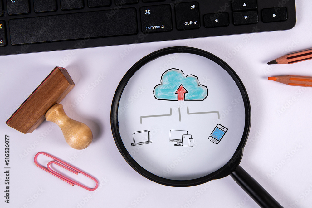 Poster cloud technology concept. magnifying glass and computer keyboard on office table