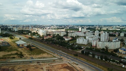 Obraz premium City block. The railway line and motorway pass nearby. Aerial photography.