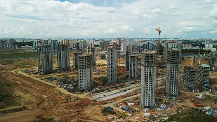 Obraz premium Construction site. Construction of multi-storey buildings. Construction of a city block. Aerial photography.