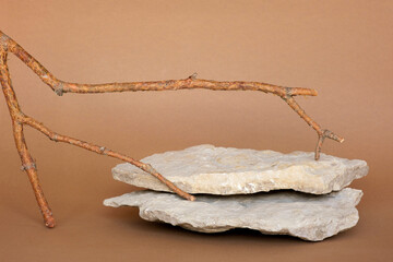 Stone Podium for promotion on beige Background. Natural pedestal. Rock. Beauty product mockup. Forest Eco Scene to show products. Showcase, display case. Front View, soft shadow. Wooden branches