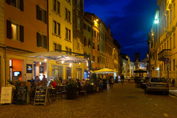 Fototapeta na wymiar TRENTO, ITALY - SEPTEMBER 1, 2019: Evening view of streets and Piazza Duomo in Trento city, Italy