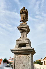 Fototapeta na wymiar statue in front of the church Santa Marinha in Cortegaca, Ovar district, Portugal