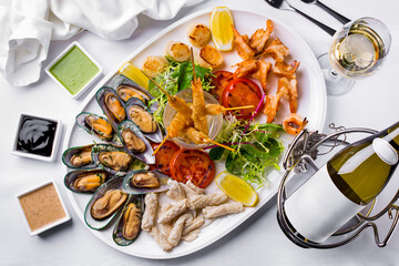 Pieces of fried fish, mussels, shrimps, fish fillets