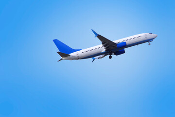 Fototapeta na wymiar Passenger plane against the blue sky.