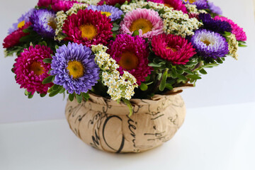 greeting card layout. bouquet of colorful asters and space for text