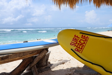Life saving yellow board with surf rescue sign. Rescue surf board.