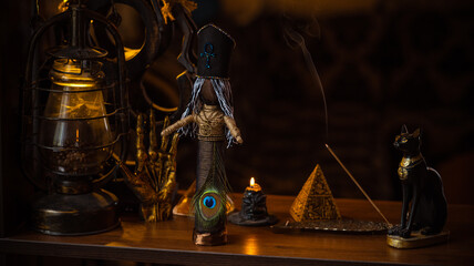 Magic doll for attracting love, rite with voodoo and fate creation, details on a table of witch,...