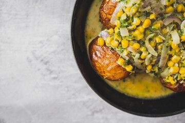 healthy plant-based food, vegan roasted potatoes with creamy corn and spinach sauce