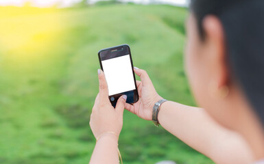 Blank cell phone screen of a girl taking a selfie. Mockup of a person Hand Holding Mobile Phone With Blank Screen And Making Selfie