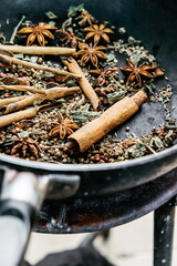 spices in a pan, A spice is a seed, fruit, root, bark, or other plant substance primarily used for flavoring or coloring food. Spices are sometimes used in medicine, cosmetics or perfume production