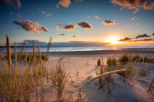 Beautiful sunset on the beach of the Sobieszewo Island at the Baltic Sea. Poland
