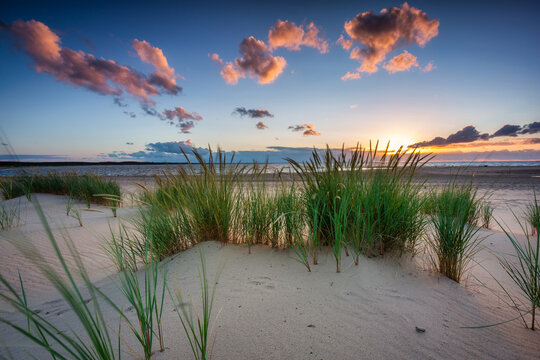 Beautiful sunset on the beach of the Sobieszewo Island at the Baltic Sea. Poland