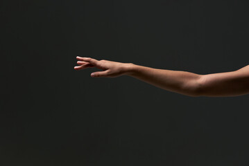Dancer arm. Tender hands of the young delicate gentle professional baller dancer on the isolated...