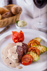 Fried pieces of meat with fried potatoes