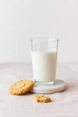Glass of fresh milk with oatmeal cookies