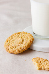 Glass of fresh milk with oatmeal cookies