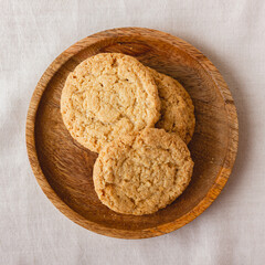 Oatmeal cookies on a wooden plate