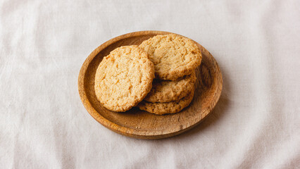 Oatmeal cookies on a wooden plate