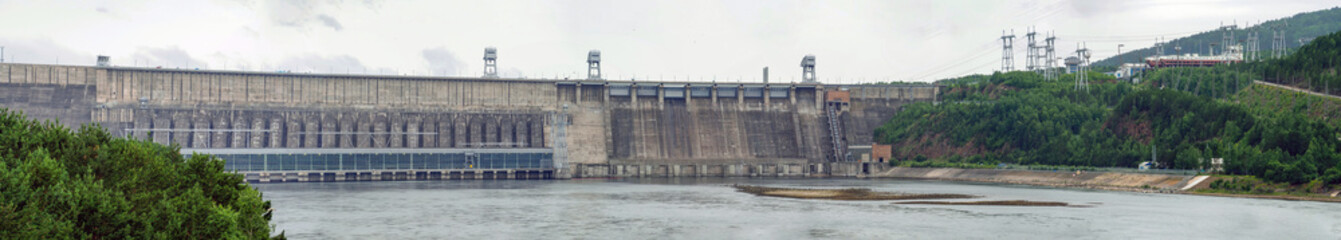 Dam of a hydroelectric power station. Industrial landscape.