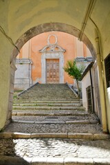 Naklejka premium The entrance door into a medieval church in Sulmona, an Italian village in the Abruzzo region.