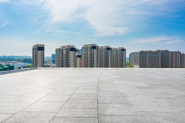 Empty square floor and city skyline with modern commercial buildings scenery, China.