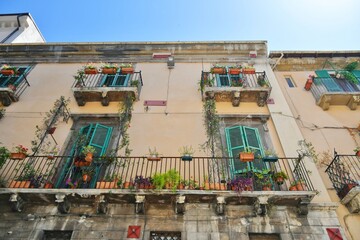 Balconies and windows of a house in the historic district of Sulmona, an Italian village in the...
