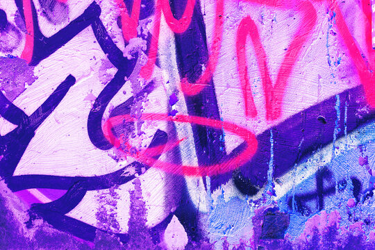 Fototapeta Closeup of colorful pink, purple, blue urban wall texture. Modern pattern for wallpaper design. Creative modern urban city background for advertising mockups. Grunge messy street style background