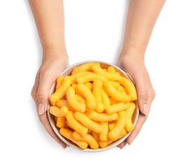 Woman holding bowl of crunchy cheesy corn sticks on white background, top view