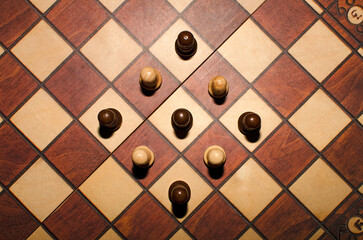 Top view of pawns on chess board