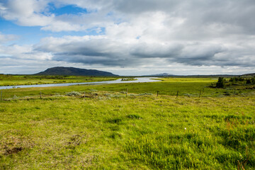 Picturesque landscape with green nature in Iceland during summer. Image with a very quiet and innocent nature.
