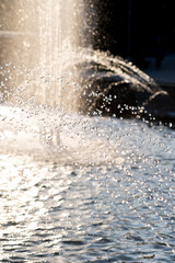 Beautiful background of water in the rays of the setting sun.