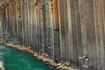 canyon with basalt columns and crystal clear water
