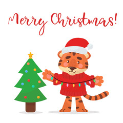 Cute Cartoon Tiger in Santa hat decorates the Christmas tree. Holiday greeting card. Merry Christmas! Isolated vector illustration.