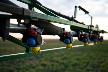 Spraying farm on a tractor close-up.