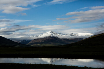 Naklejka premium Picturesque landscape with green nature in Iceland during summer. Image with a very quiet and innocent nature. 