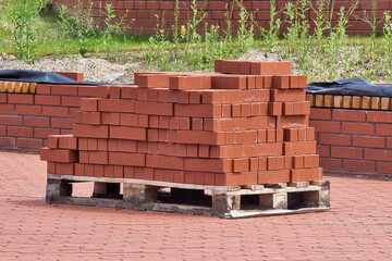 Pallet of red clay bricks pallet. Outside in the Lithuania