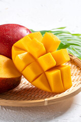 Mango background design concept. Top view Diced fresh mango fruit on white table.