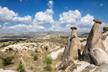 Cappadocia wide angle view with clouds and fairy chimneys