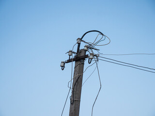 old damaged electric pole power lines