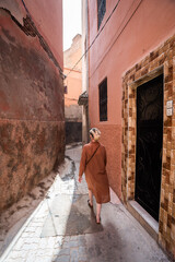 Woman going thru streets of Marrakesh, Morocco