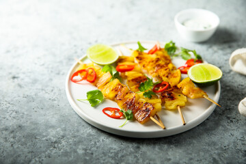 Healthy pineapple skewers with chili and lime