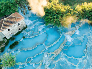 View from above, stunning aerial view of Le Cascate del Mulino, a group of beautiful hot springs in...
