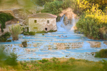 Stunning view of Le Cascate del Mulino, a group of beautiful hot springs in the municipality of Manciano, Tuscany.
