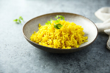 Healthy vegan turmeric rice with fresh parsley